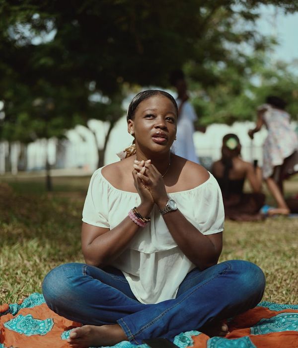 Woman in a calm yoga pose, embodying balance and focus.